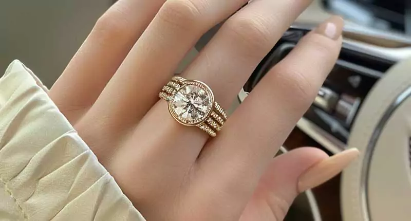 A girl's hand with a diamond ring
