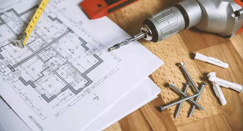 Blueprints and electric drill